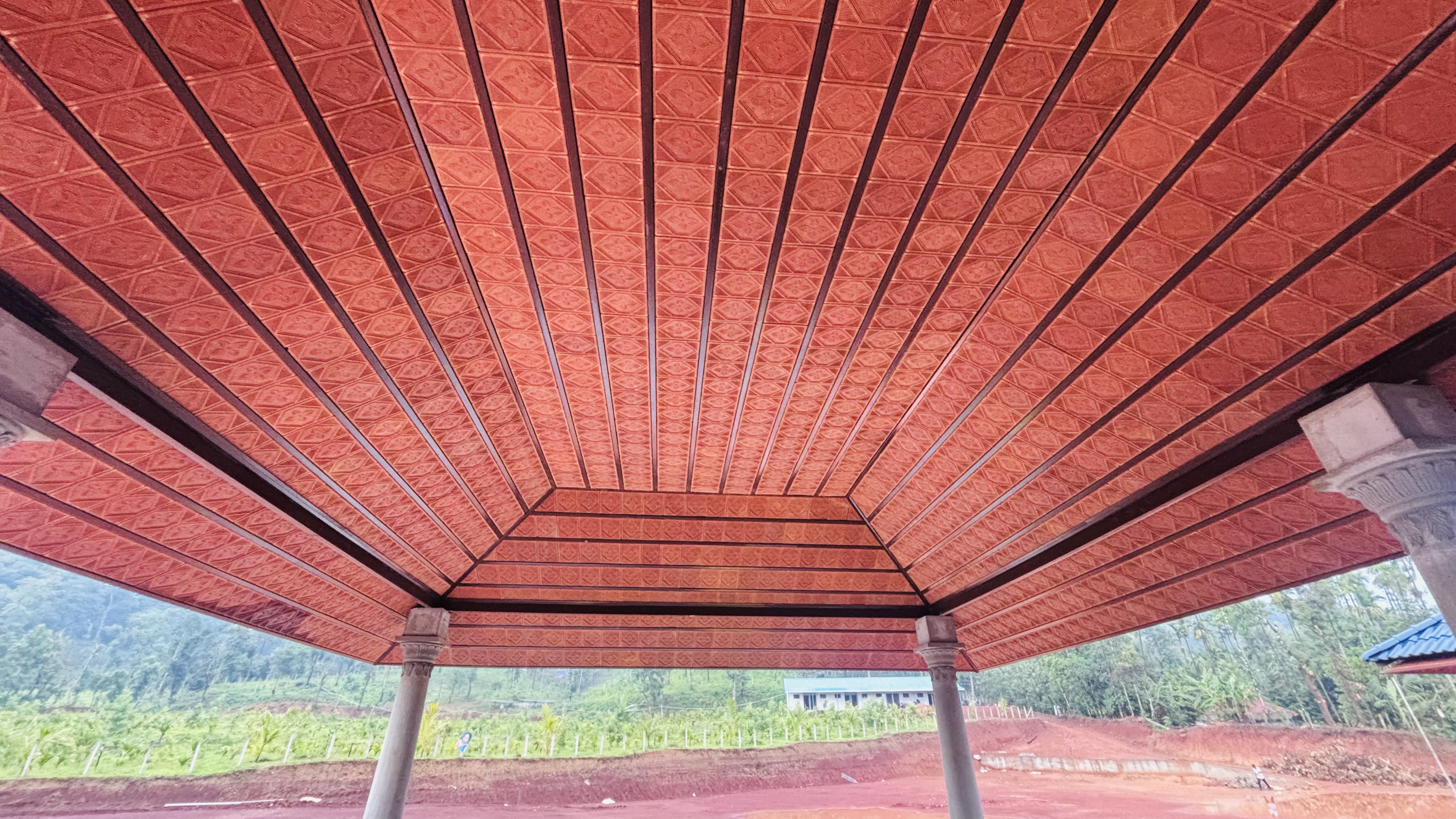 Decorative red roofing ceiling seen from below