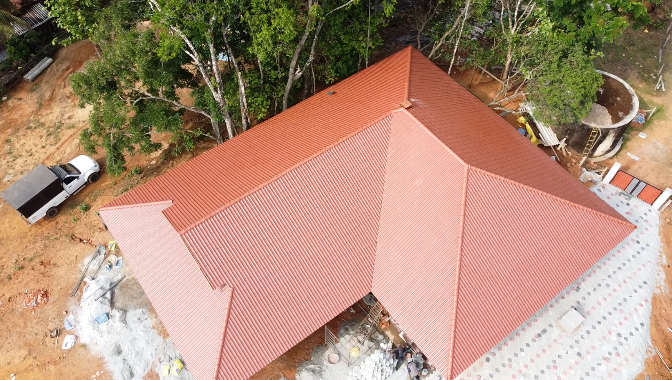 Orange roof tile installation captured from above